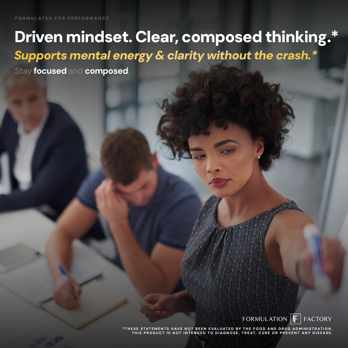 A focused businesswoman with curly hair presents at a whiteboard while colleagues take notes, under the large text "Driven mindset. Clear, composed thinking. Supports mental energy & clarity without the crash."